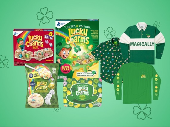 Lucky Charms products including Lucky Charms Treat Bars, Pillsbury Ready to Bake! Lucky Charms Sugar Cookie Dough and Lucky Charms Turns Milk Green Limited Edition Cereal placed on a green background with four-leaf clovers for St. Patrick’s Day.
